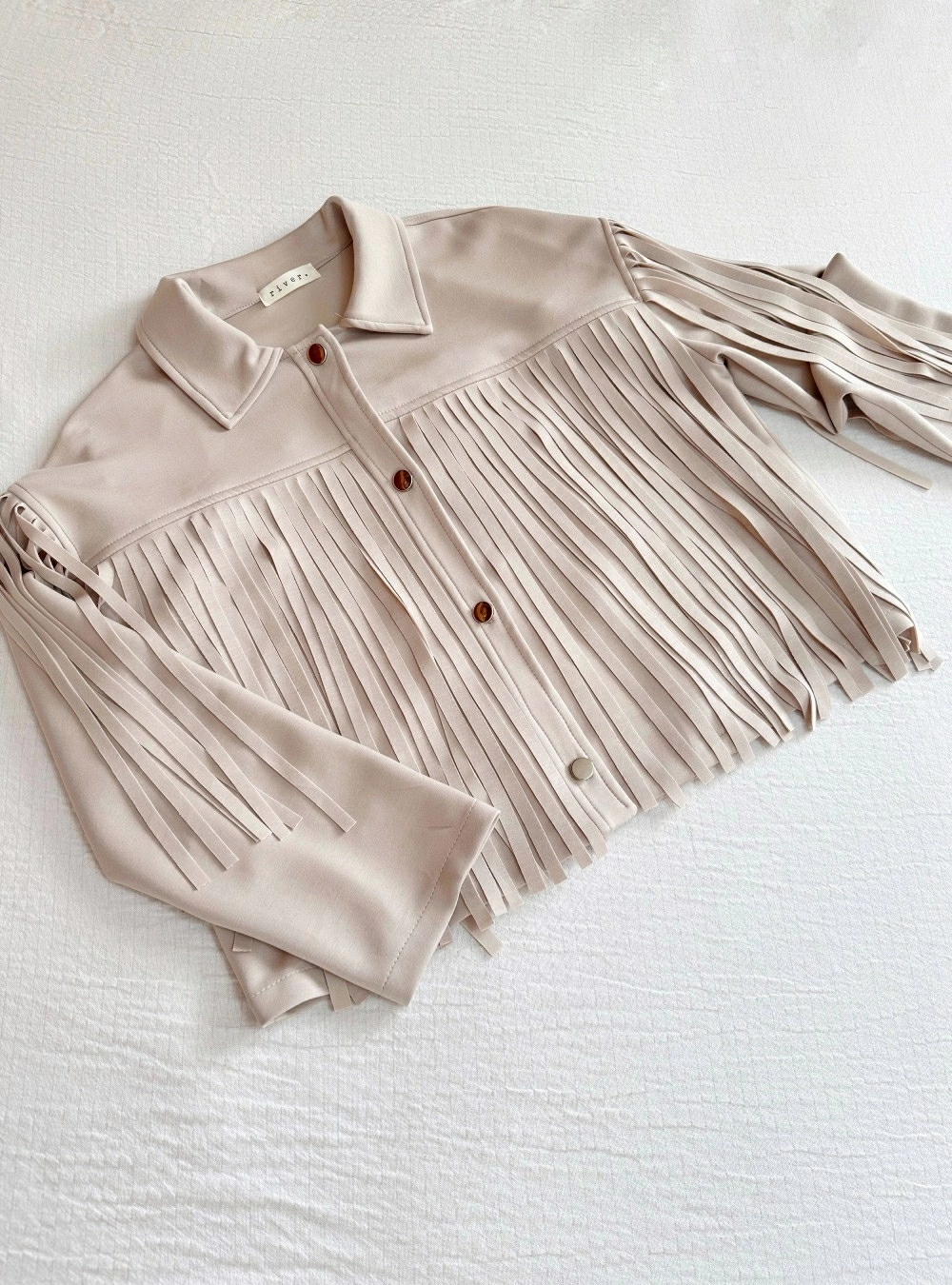 Chaqueta botones y flecos