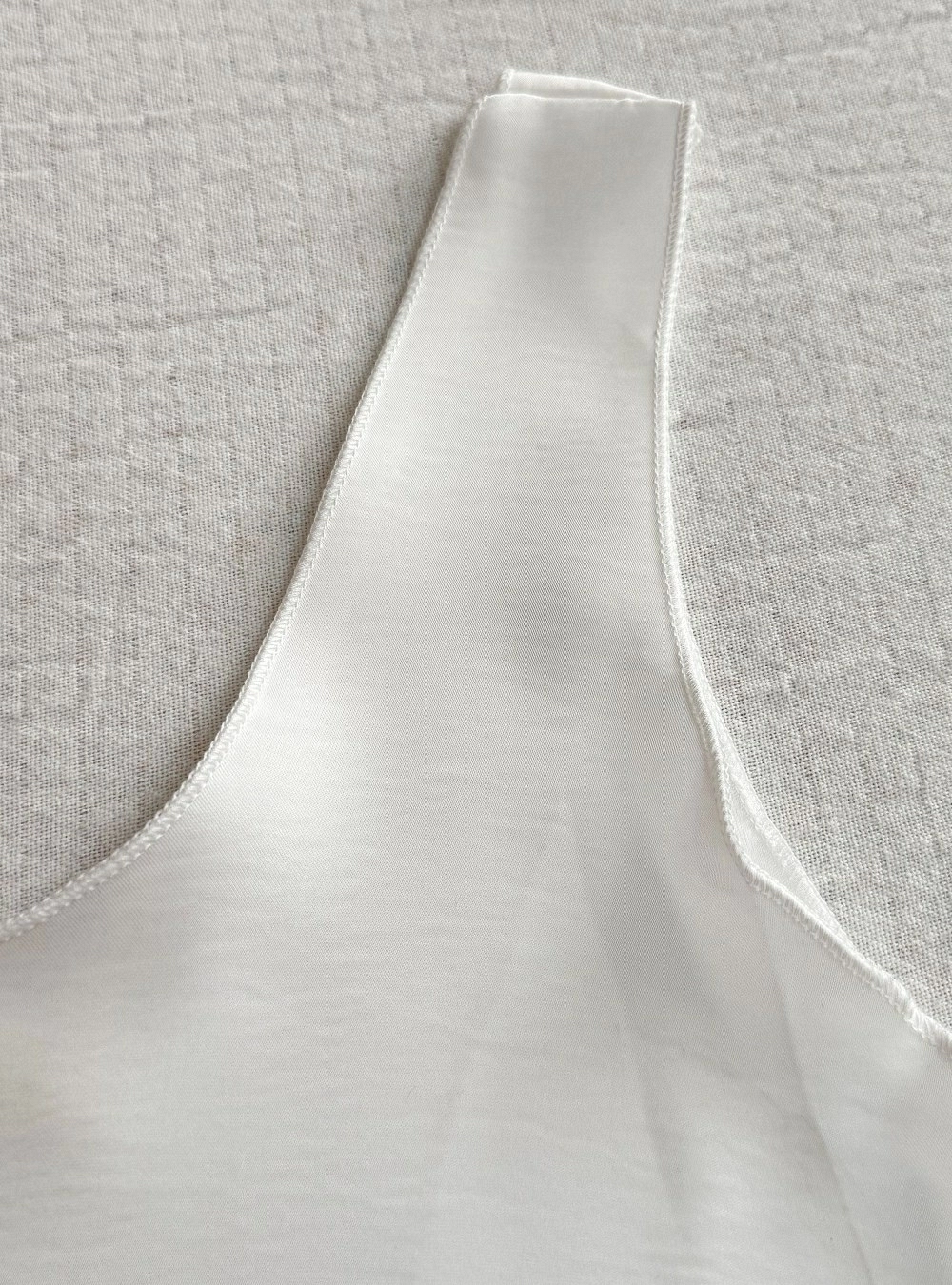 Top lencero borde remallado